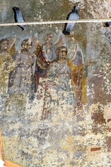 frescoes on the walls of an abandoned temple
