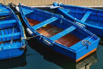 Fototapeta na wymiar Blue boats moored in the port of the city of Luarca, in Asturias.