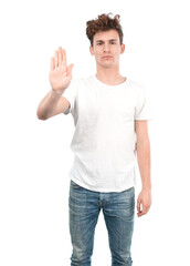 Naklejka premium Serious young guy with a gesture of stop