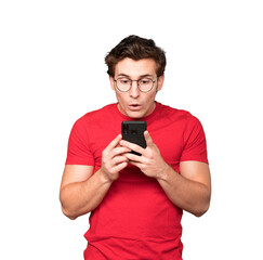 Fototapeta premium Shocked young man using a mobile phone