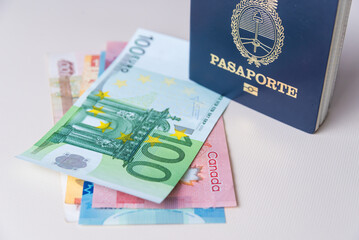 passport with banknotes from different countries, close up