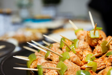 Close up of chicken and pepper brochettes for an event. Food concept.