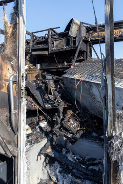 Burned out RV motorhome interior from a fire or explosion or fire bomb or arson shows the melted interior and the devastation of the accident.