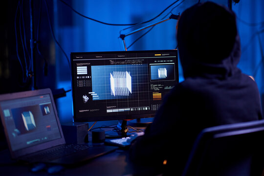cybercrime, hacking and technology concept - programmer or hacker working with 3d graphics on computer in dark room
