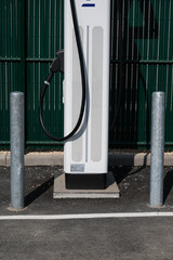 Close-up of the bottom of an electrical terminal at a charging station.