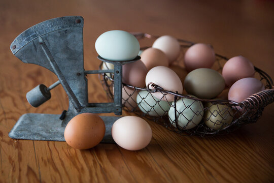 Close-up of eggs in container with vintage scale on table