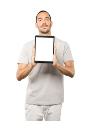 Young man doing gestures using a tablet