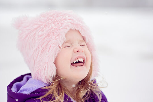 Close-up of girl with eyes closed during winter