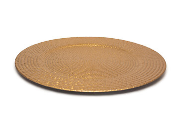 An empty golden textured plate on a white background