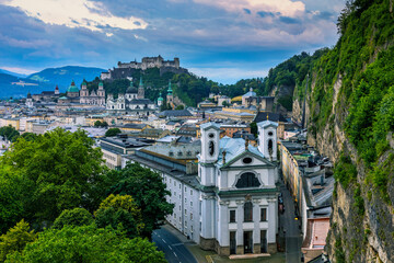 Fototapeta premium Beautiful view of the historic city of Salzburg with Festung Hohensalzburg in summer, Salzburger Land, Austria. Panoramic summer cityscape of Salzburg, Old City, birthplace of famed composer Mozart.