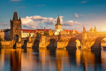 Naklejka premium Old town of Prague. Czech Republic over river Vltava with Charles Bridge on skyline. Prague panorama landscape view with red roofs. Prague view from Petrin Hill, Prague, Czechia.