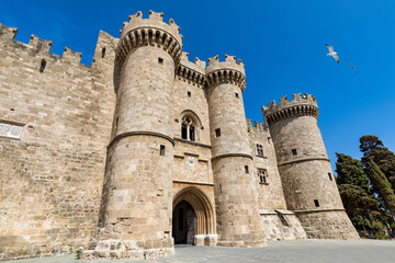 The Palace of the Grand Master of the Knights of Rhodes, Greece. Famous Knights Grand Master Palace (also known as Castello) in the Medieval town of Rhodes, Greece. - obrazy, fototapety, plakaty
