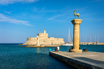 Mandraki port with deers statue, where The Colossus was standing and fort of St. Nicholas. Rhodes,...