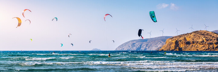 Surfers in Prasonisi Beach in Rhodes island, Greece. Kiteboarder kitesurfer athlete performing...