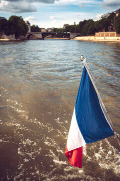 Close-up of French Flag by Seine River in city