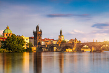 Fototapeta premium Charles Bridge sunset view of the Old Town pier architecture, Charles Bridge over Vltava river in Prague, Czechia. Old Town of Prague with Charles Bridge, Prague, Czech Republic.