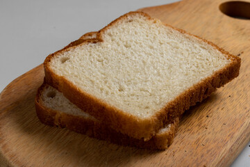 Toasted Loaf Bread with Margarine on a wood over the table
