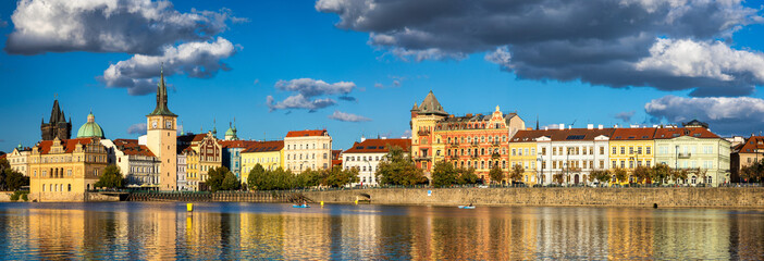 Old Town of Prague in Czechia. Prague, Czech Republic. Vltava River and old buildings across the river. Concept of world travel, sightseeing and tourism.