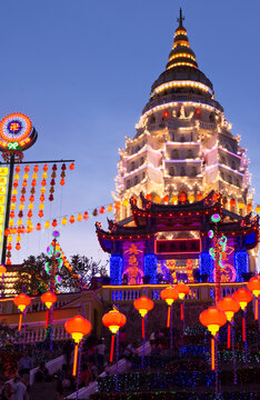 Low angle view of illuminated Kek Lok Si Temple against clear sky in city