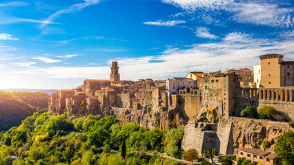 Medieval Pitigliano town over tuff rocks in province of Grosseto, Tuscany, Italy. Pitigliano is a small medieval town in southern Tuscany, Italy. - obrazy, fototapety, plakaty