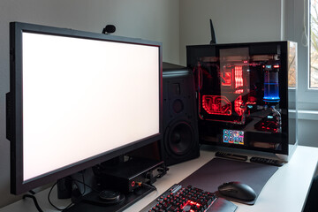 Powerful personal computer gamer rig with white screen. Professsional gaming empty room studio with...