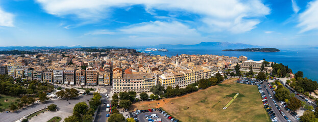 Panoramic view of Kerkyra, capital of Corfu island, Greece. Aerial drone view of Kerkyra with beautiful buildings during summer sunny day. Corfu island, Greece.