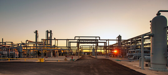 Petrochemical plant against clear sky at Permian Basin during sunset