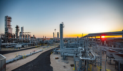 View of petrochemical plant against clear sky at Permian Basin during sunset