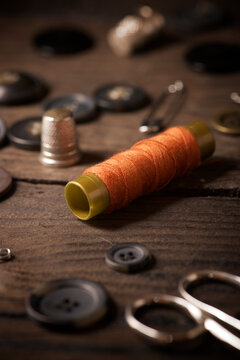 High angle view of various sewing items on fabric