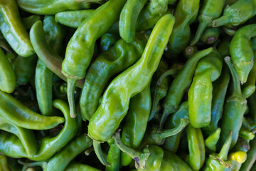 High angle view of green chili peppers for sale at market