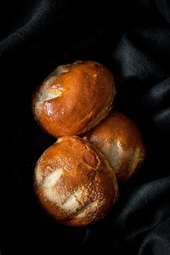 High angle view of brioches on fabric