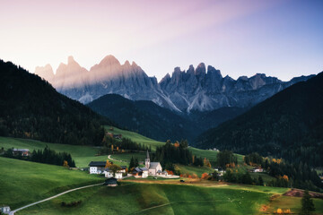 Scenic view of green landscape against sky during sunrise