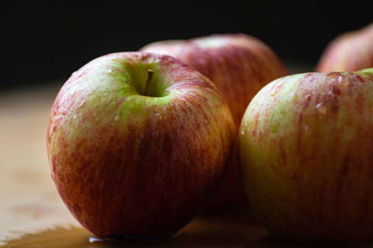 Close-up of wet apples on table during autumn