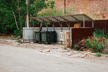 Obraz na płótnie Canvas Garbage collection site. Two trash dumpsters