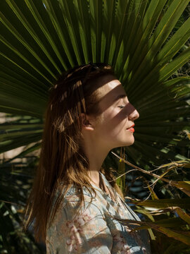 Girl Portrait with sunlight through leaf