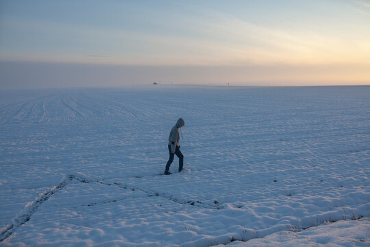 the boy is alone in the snow field
