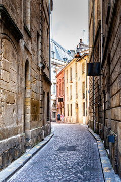 Narrow cobblestoned street in historic city center of Bordeaux