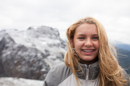 Portrait of young woman smiling outdoors