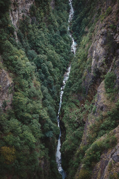 A river winds through a deep gorge seen from above
