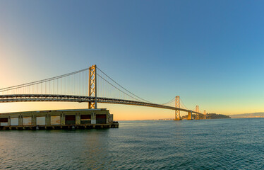 Fototapeta na wymiar view to Bay bridge in San Francisco in sunset mood with skyline