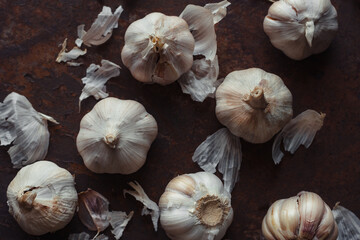Garlic bulbs on rusty metal floor