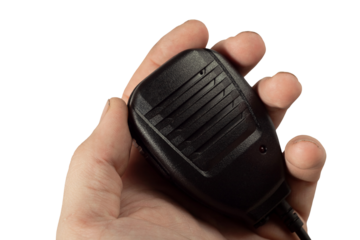 Isolated black radio transmitter controller in a human hand without background close-up