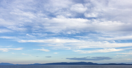 Obraz premium Cloudy Cloudscape during sunny summer Day on the West Coast of Pacific Ocean. British Columbia, Canada. Sunset Sky