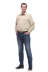 Full length portrait of a casual young man with hands in his pockets