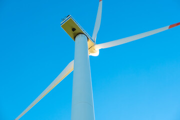 Wind generator on a blue sky background.Natural renewable clean energy.renewable energy.Rotation of...