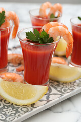 Delicious shrimp cocktail with tomato sauce, closeup