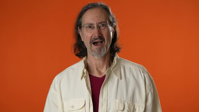 Shocked Surprised Mature Bearded Man 50s Look Camera Say Wow Omg No Way Isolated On Solid Orange Background Studio Portrait