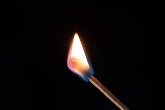 Smoke from burning matchsticks on a black background