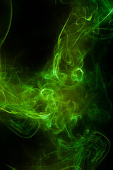 Fototapeta premium Green smoke motion on black background.