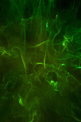 Obraz na płótnie Canvas Green smoke motion on black background.